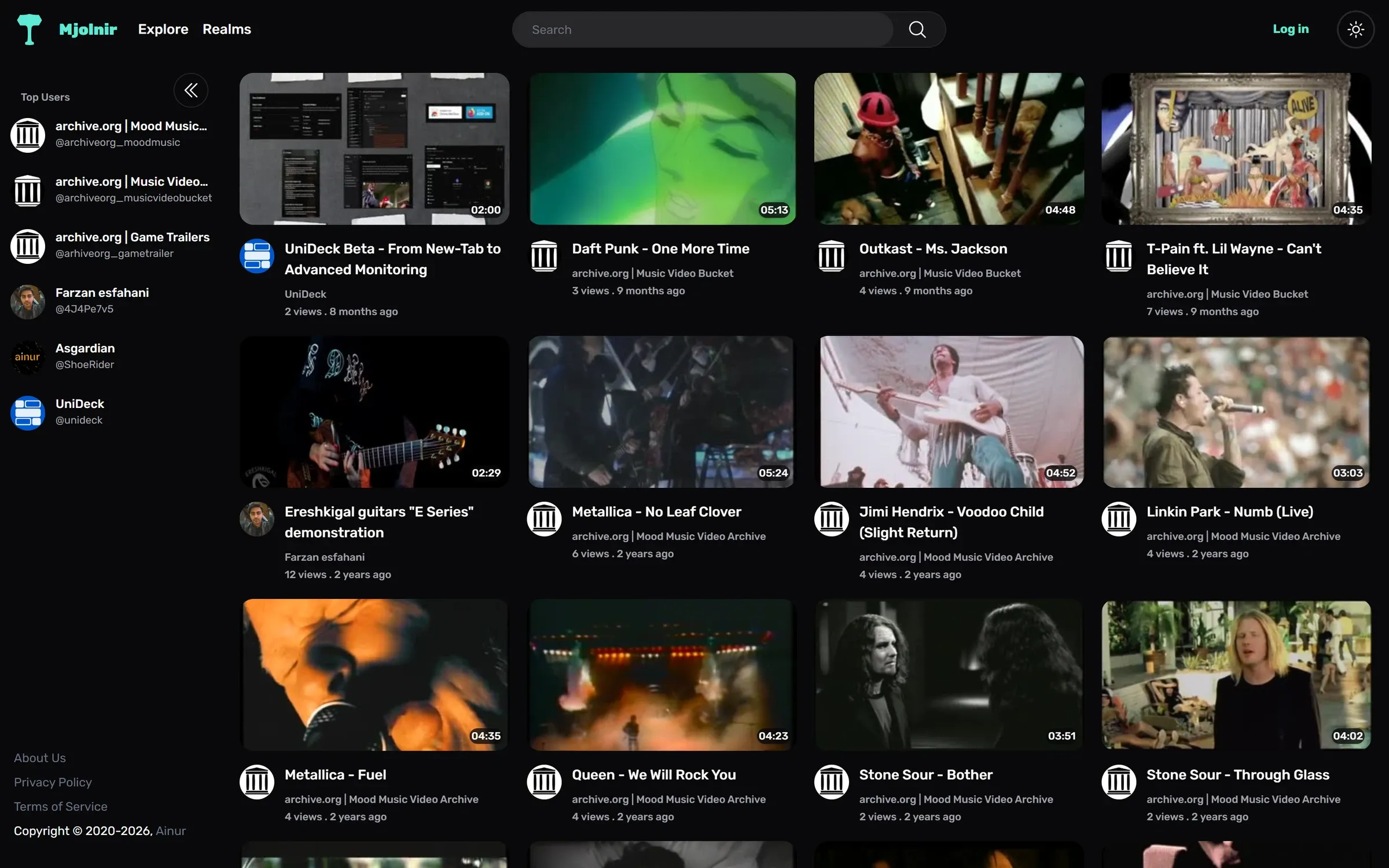 The Mjolnir home page: a dark interface with a teal wordmark, Explore and Realms navigation, a search field, a Top Users sidebar, and a grid of video cards showing durations and view counts.